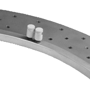 A close up of two white pills on top of a metal object.