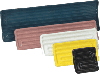 A group of different colored plastic trays.