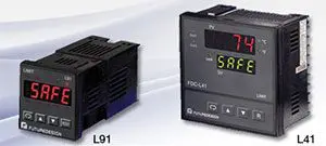 A red bird with wings spread and a tail.