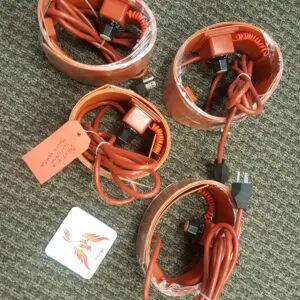 Four orange cords are wrapped around a pair of speakers.