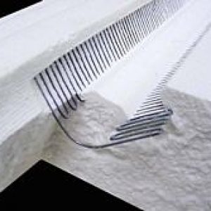 A close up of the comb on a mattress