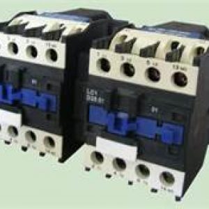 A couple of electrical contactors are sitting on top of each other