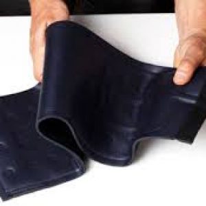 A person is folding a black wallet